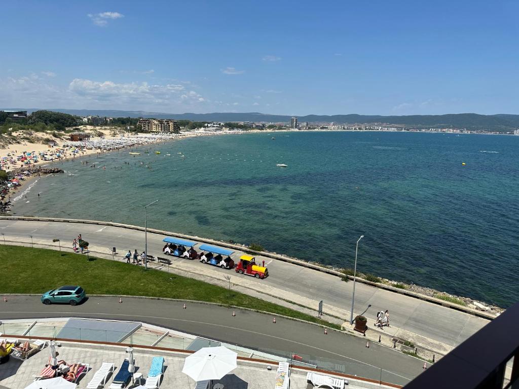 a view of a beach with people and the water at Sea View Private Studio Paradiso B 508 in Nesebar