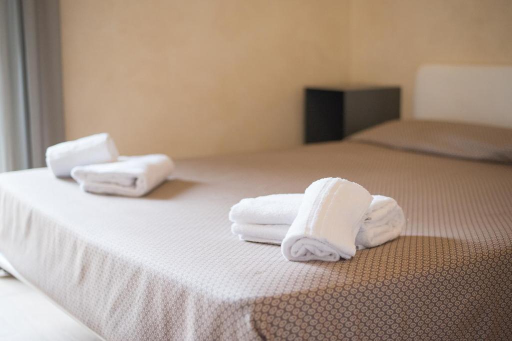 Posteľ alebo postele v izbe v ubytovaní Lazise Boutique Apartment Lago e Relax
