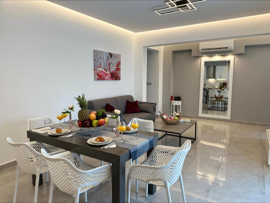 a living room with a table and chairs at Flev's Luxury House with pool in Kremasti