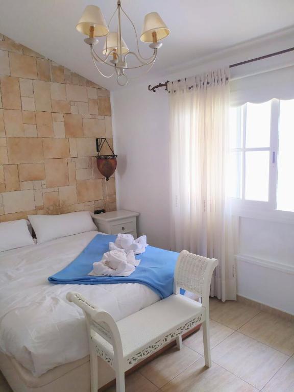 A bed or beds in a room at Casa Sagittarius Ocean view
