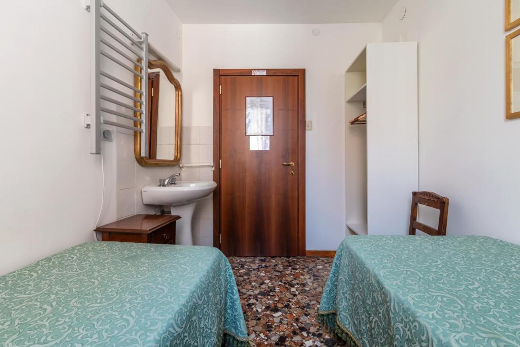 Postel nebo postele na pokoji v ubytování Hotel Casa Boccassini