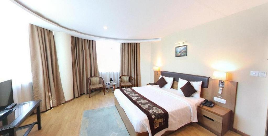 Postel nebo postele na pokoji v ubytování Hotel Mirage Regency