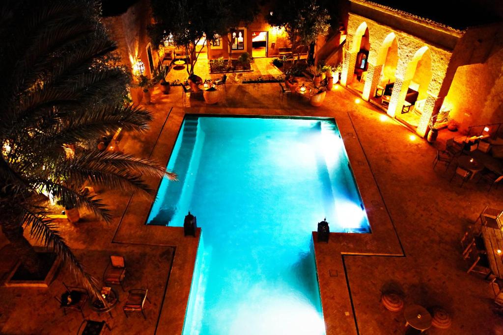 an overhead view of a swimming pool at night at Le moulin in Taroudant