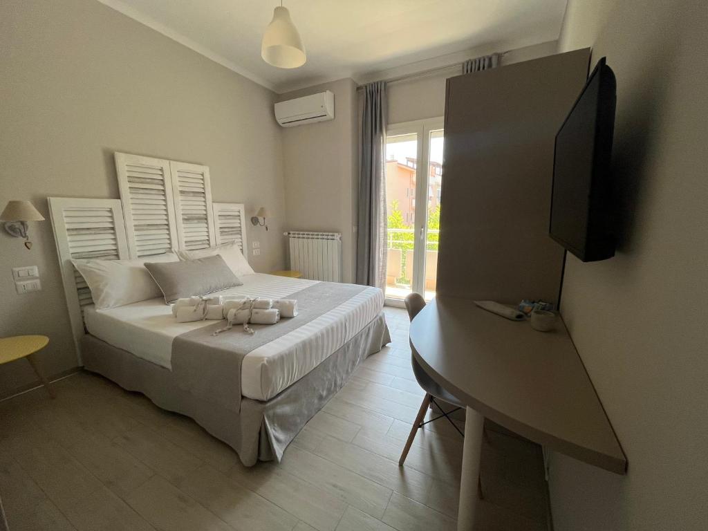 Postel nebo postele na pokoji v ubytování B&B L’ALTRAMURGIA