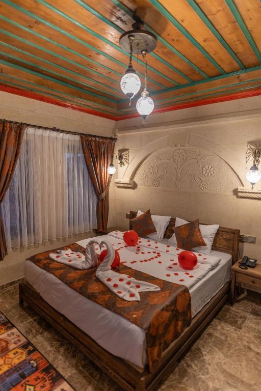 Postel nebo postele na pokoji v ubytování Cordial Cappadocia Hotel