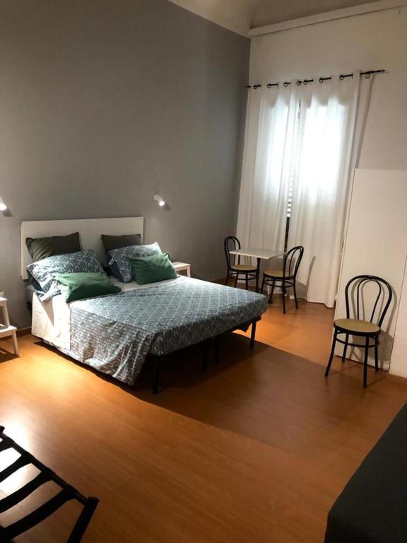 Postel nebo postele na pokoji v ubytování Relais Florence