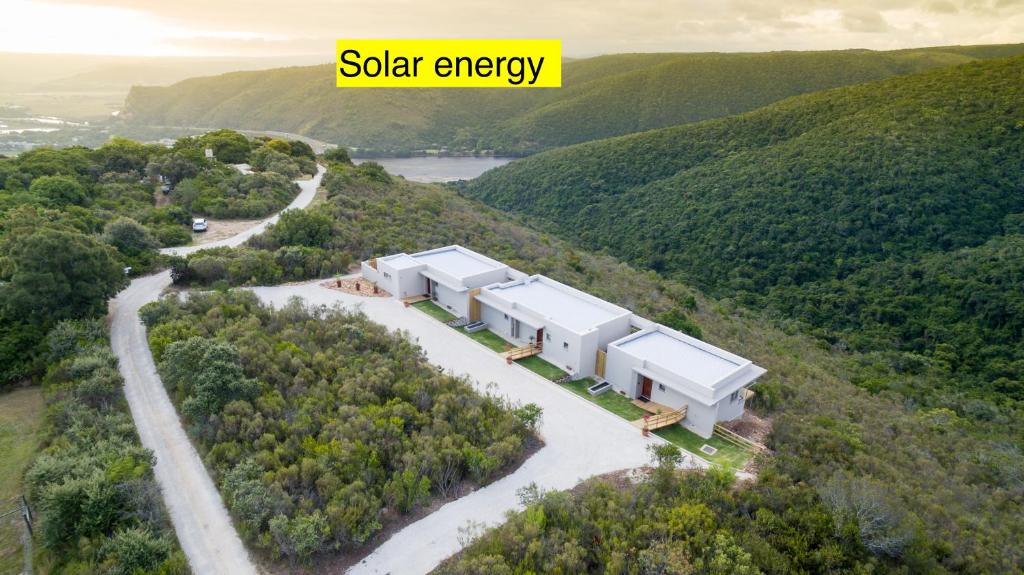 an aerial view of a solar energy house on a hill at Alkantmooi Private Nature Reserve - Keurkloof in Plettenberg Bay