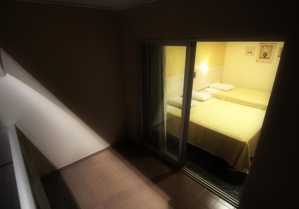 Postel nebo postele na pokoji v ubytování Hotel Três Fronteiras