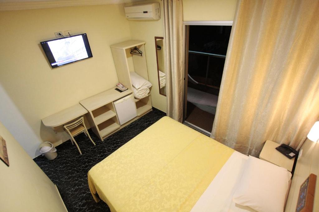 Postel nebo postele na pokoji v ubytování Hotel Três Fronteiras
