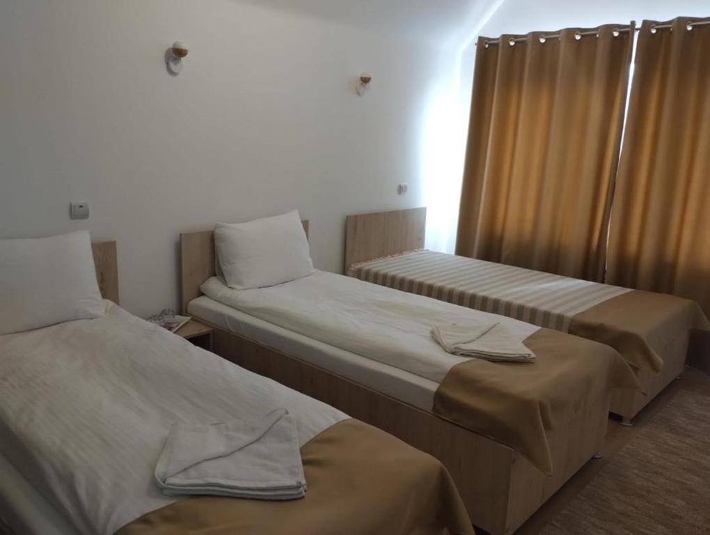 מיטה או מיטות בחדר ב-Casa Darius Cluj