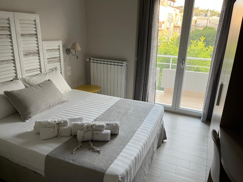 Postel nebo postele na pokoji v ubytování B&B L’ALTRAMURGIA