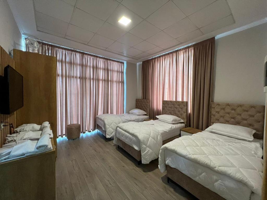 מיטה או מיטות בחדר ב-Hotel Princ