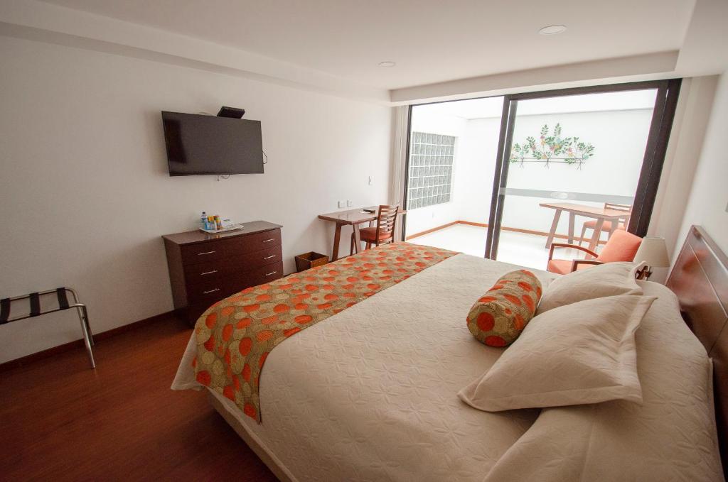 Postel nebo postele na pokoji v ubytování Hotel Cuellars
