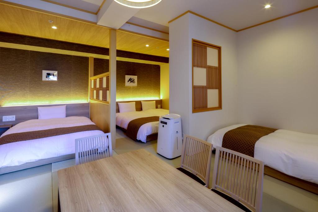 Postel nebo postele na pokoji v ubytování Dormy Inn Premium Ginza