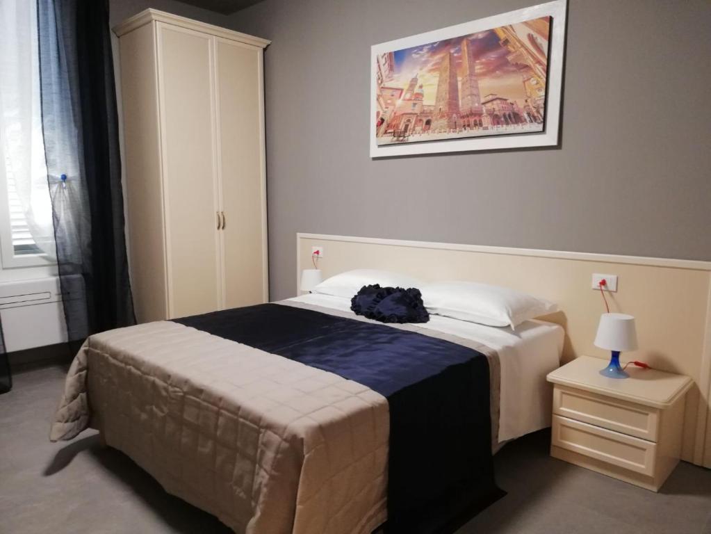 Säng eller sängar i ett rum på Casa Ambra