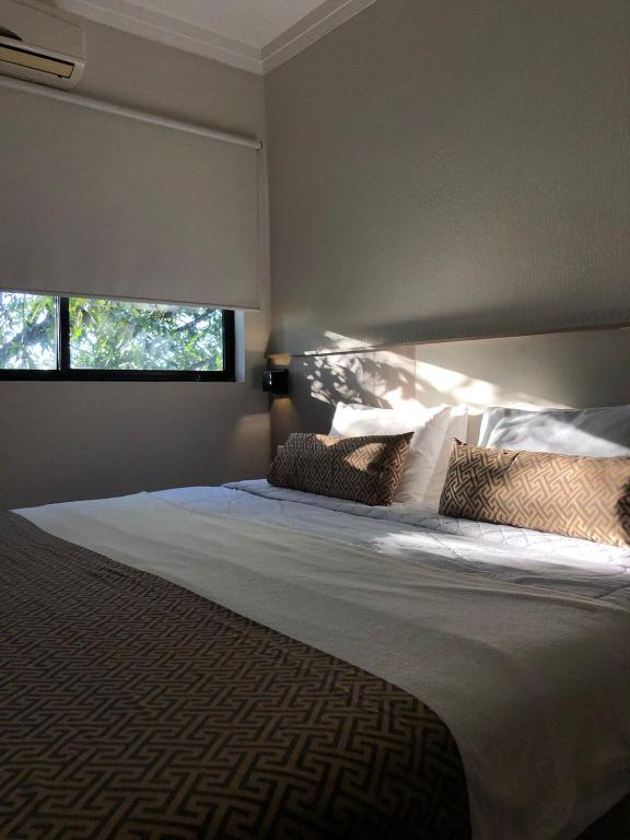 Postel nebo postele na pokoji v ubytování Iguassu Express Hotel