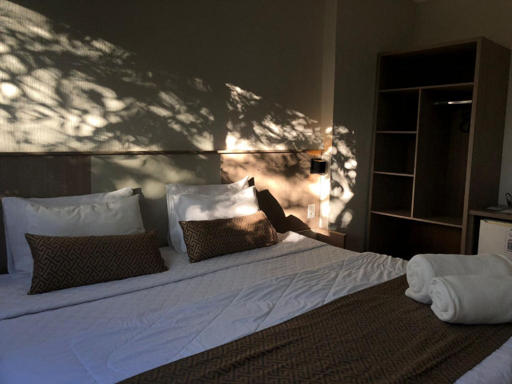Postel nebo postele na pokoji v ubytování Iguassu Express Hotel