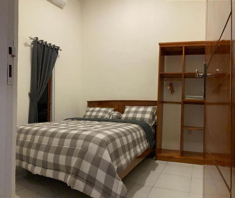 Postel nebo postele na pokoji v ubytování LOPE HOMESTAY
