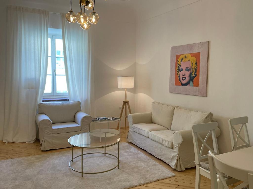 a living room with a couch and a table at Apartment Zum Dom in Graz