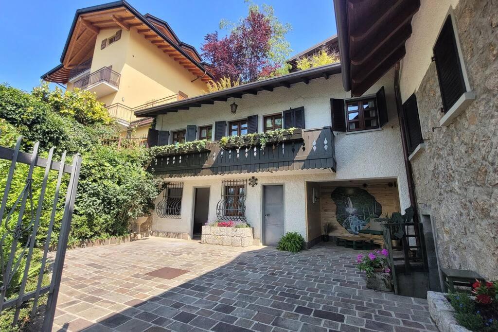 a house with a brick driveway in front of it at Presolana Suite in Love casa vacanza in Castione della Presolana