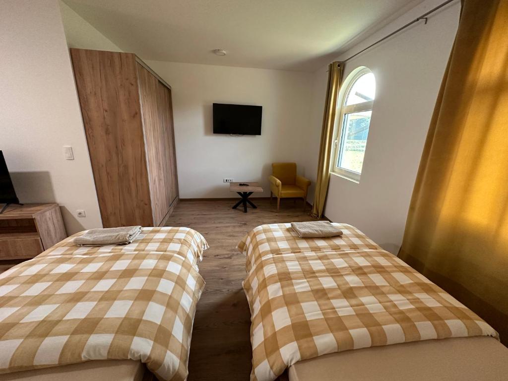 Postel nebo postele na pokoji v ubytování Apartmani BMD