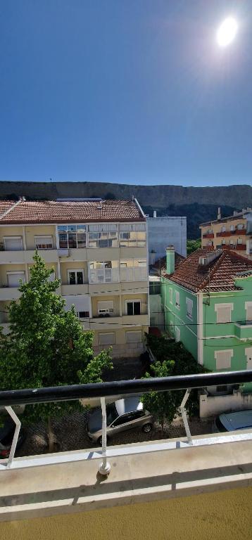 a view from a balcony of a building at Apartamento Santo António in Costa da Caparica