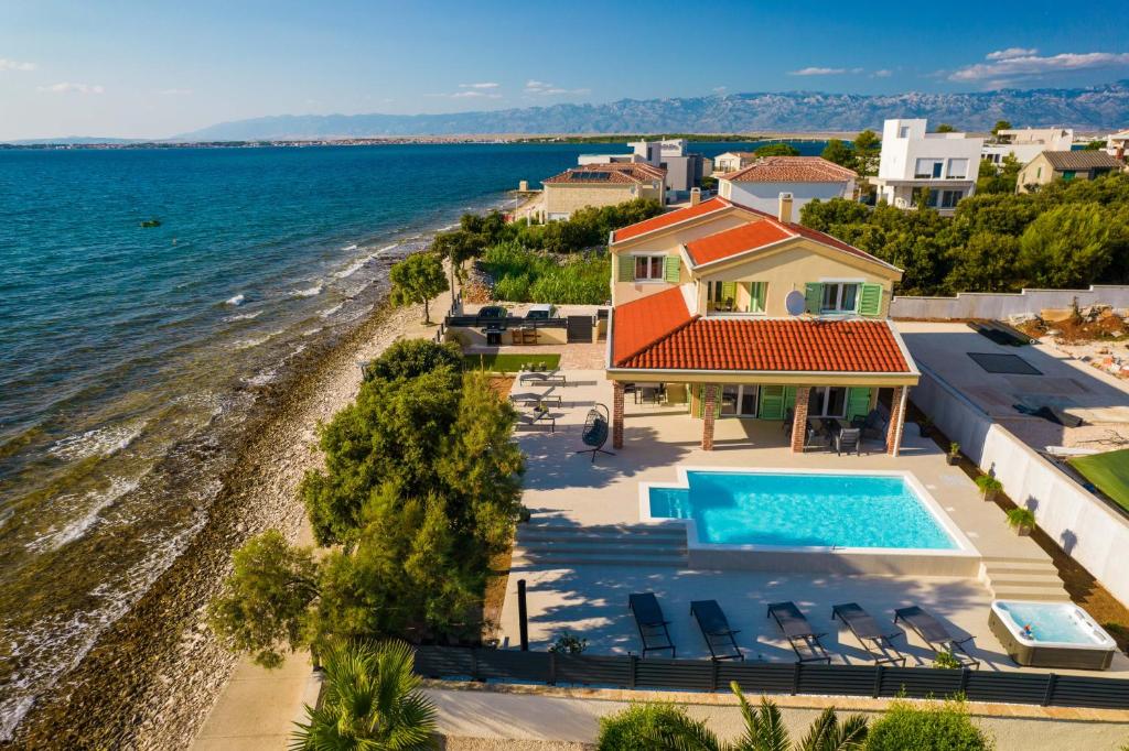 an aerial view of a villa with a swimming pool at Exclusive luxury Villa with glorious sea view - by TA Leut Agency in Privlaka