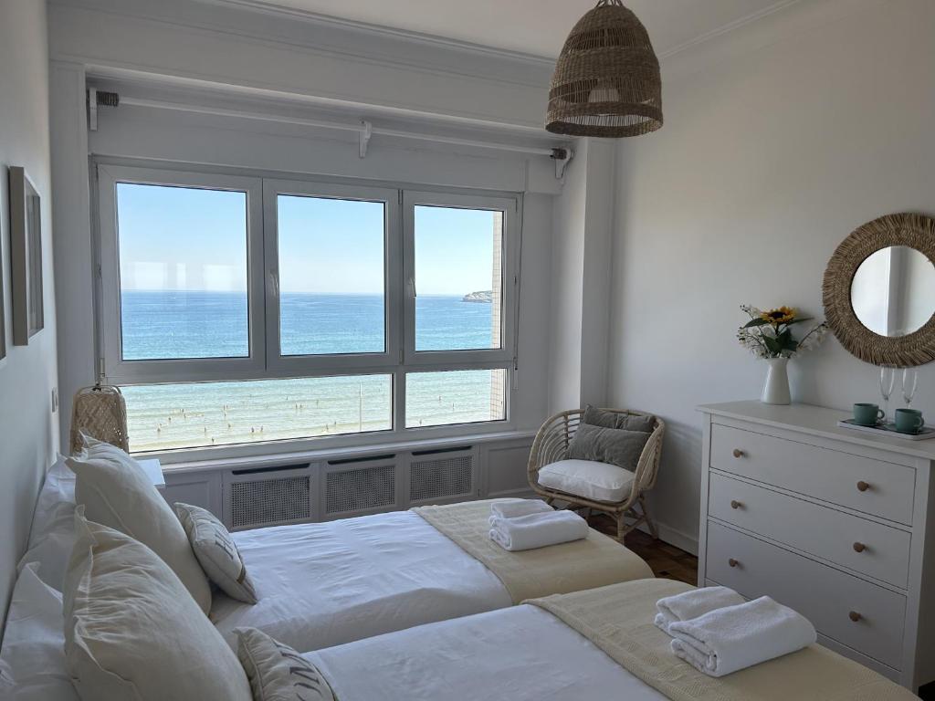 Кровать или кровати в номере Apartamento Paseo del Muro