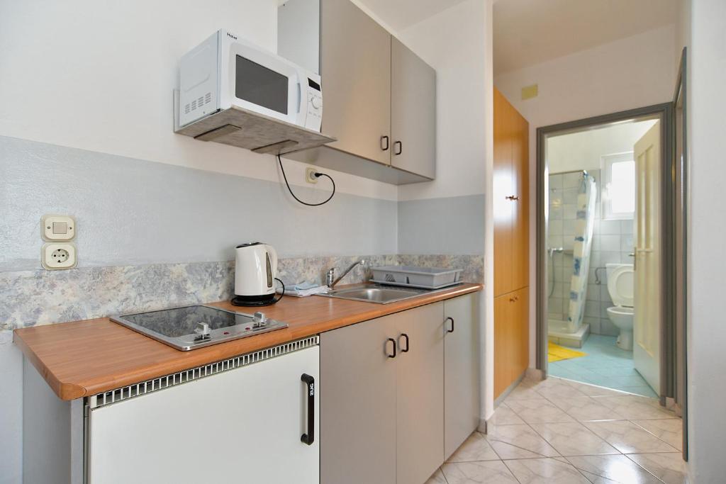 Kuchyň nebo kuchyňský kout v ubytování Apartments Stefko 2071