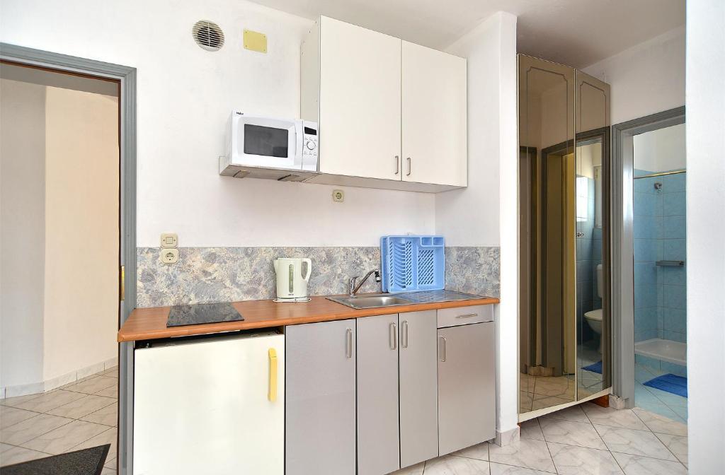 Kuchyň nebo kuchyňský kout v ubytování Apartments Stefko 2071