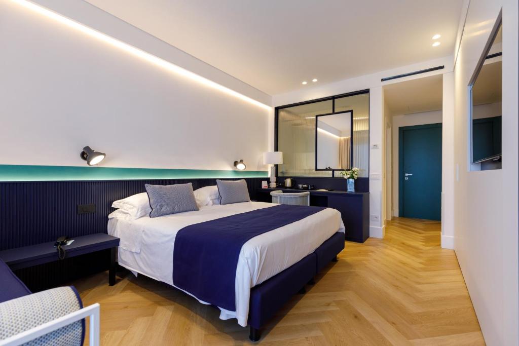 Postel nebo postele na pokoji v ubytování Grand Hotel Cesare Augusto