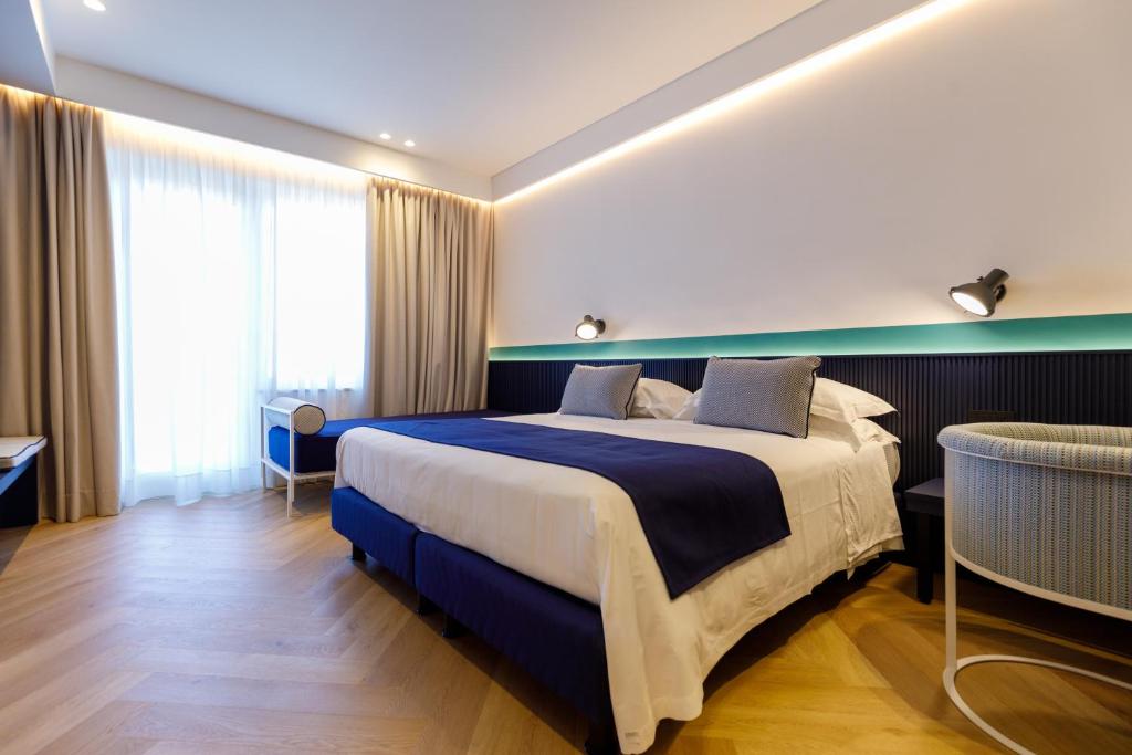 Postel nebo postele na pokoji v ubytování Grand Hotel Cesare Augusto