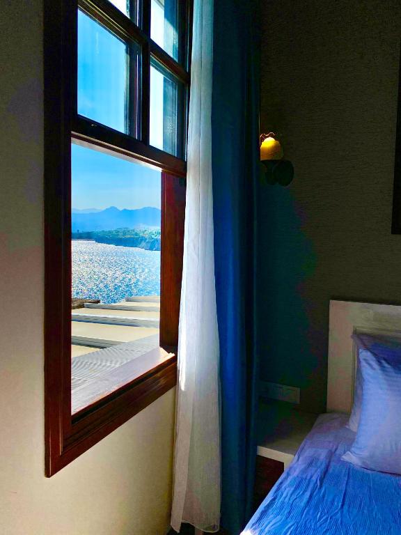 Postel nebo postele na pokoji v ubytování Ulivo Hotel