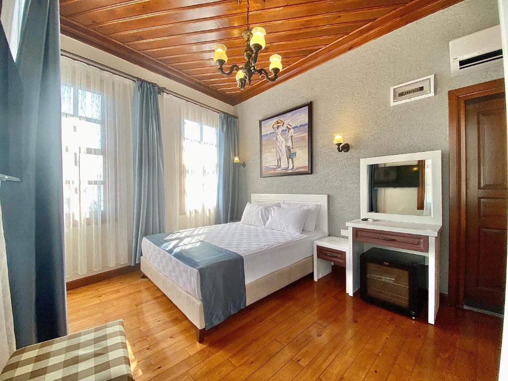 Postel nebo postele na pokoji v ubytování Ulivo Hotel