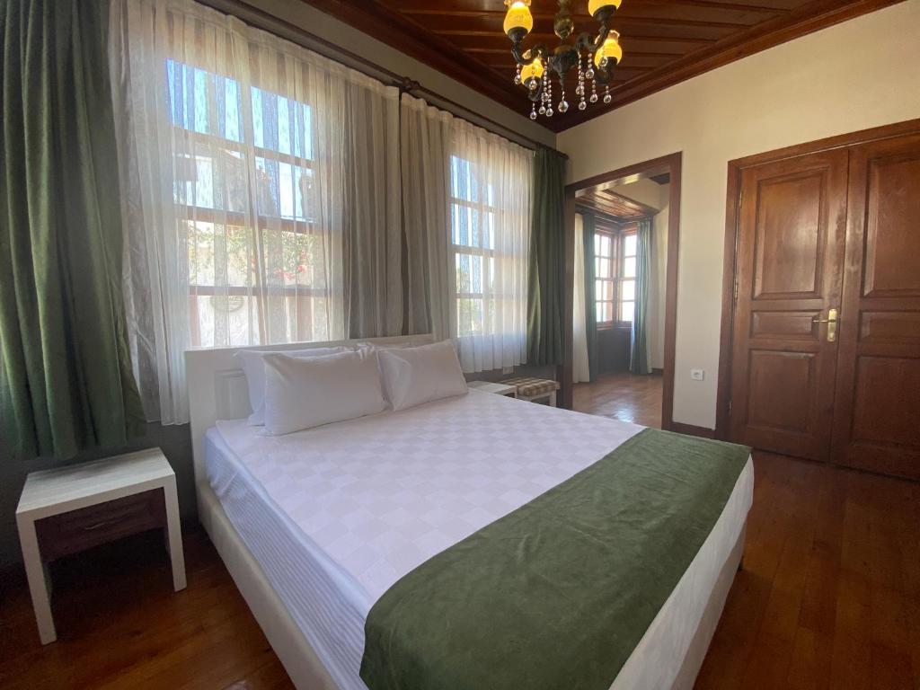 Postel nebo postele na pokoji v ubytování Ulivo Hotel