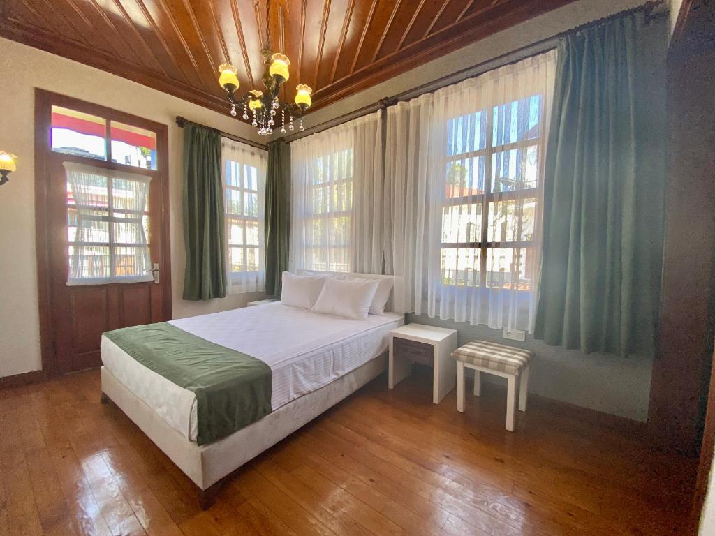 Postel nebo postele na pokoji v ubytování Ulivo Hotel