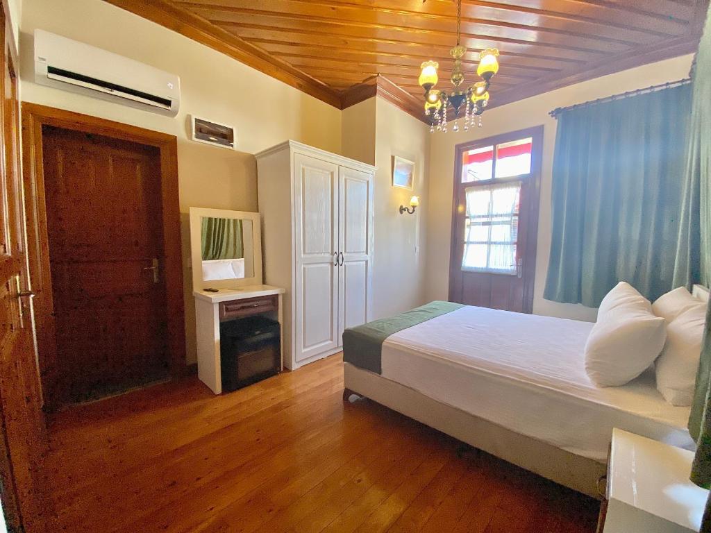Postel nebo postele na pokoji v ubytování Ulivo Hotel