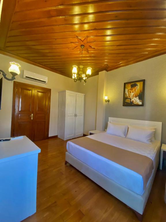 Postel nebo postele na pokoji v ubytování Ulivo Hotel