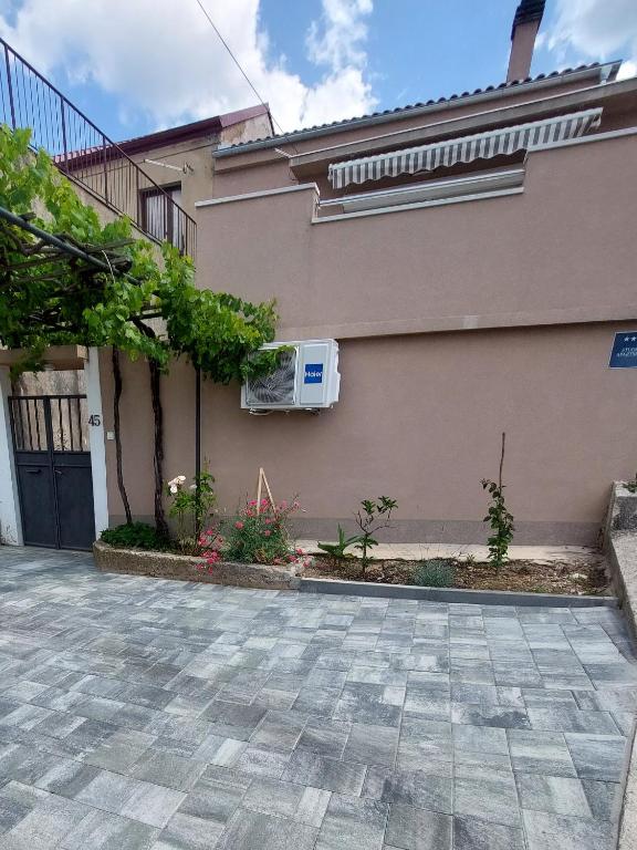 a house with a air conditioner on the side of it at Vita in Bribir