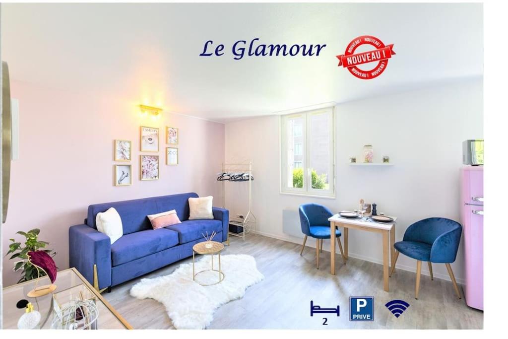 a living room with a blue couch and chairs at LE GLAMOUR *STUDIO *PARKING PRIVE* *WIFI*CALME* in Lourdes