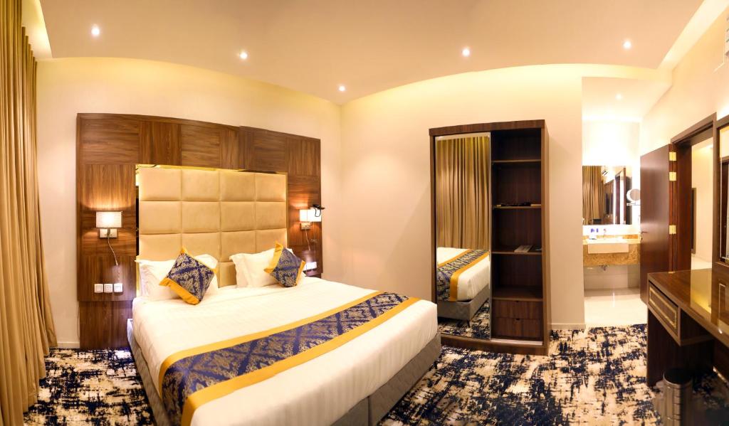 Postel nebo postele na pokoji v ubytování Oriens Hotel