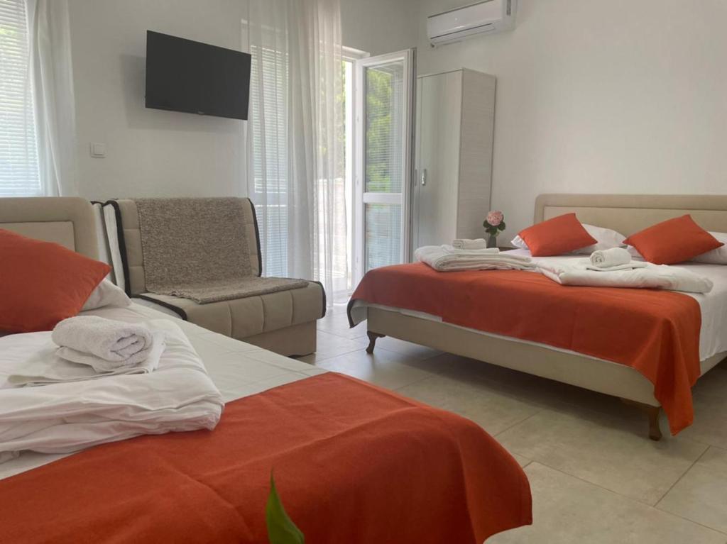Postel nebo postele na pokoji v ubytování Jelić apartmani