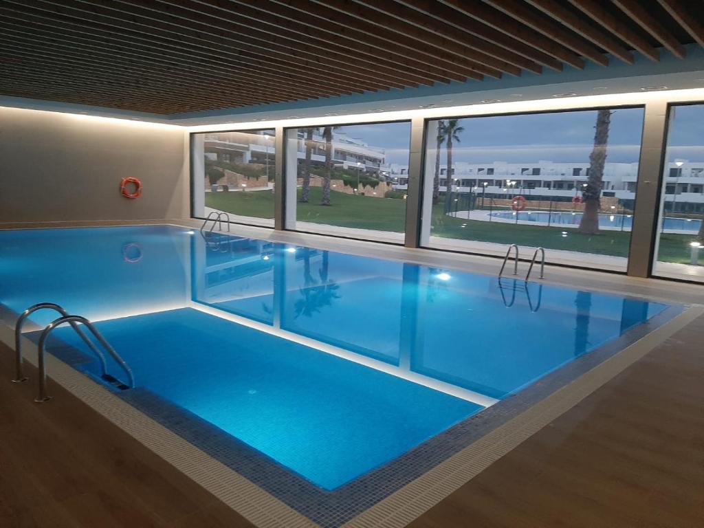 Bazén v ubytování Casa Holiday Finestrat - 3 bedroom flat with common pool nebo v jeho okolí