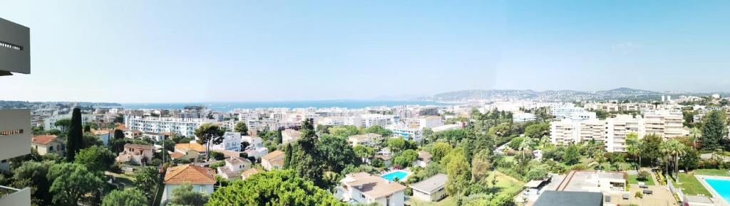 a view of a city with buildings and trees at Charming T2 Eden Park with swimming pool private parking in Juan-les-Pins