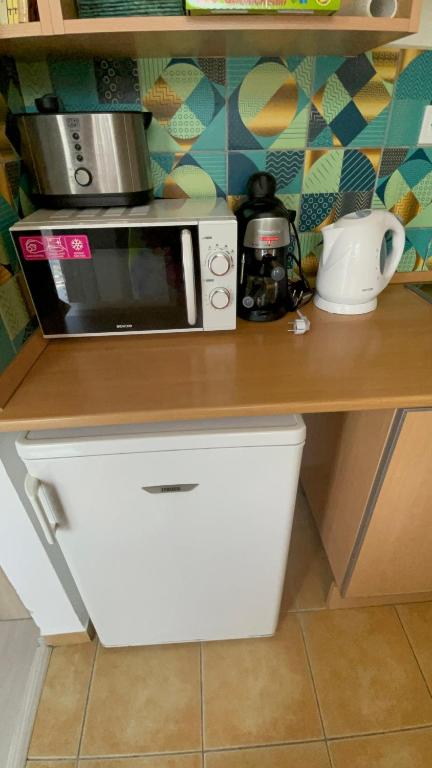 Kuchyňa alebo kuchynka v ubytovaní Joy Apartman