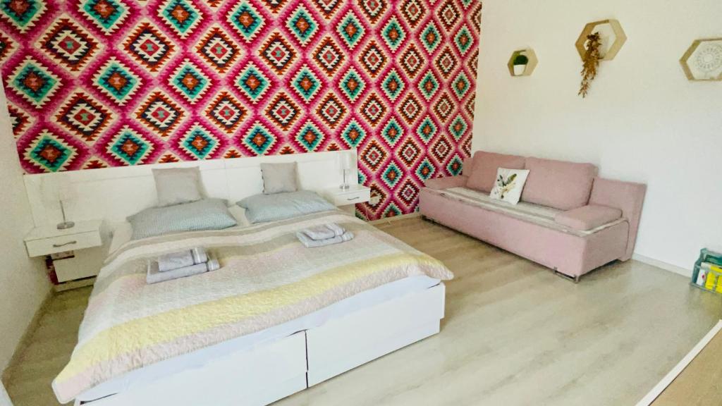 Posteľ alebo postele v izbe v ubytovaní Joy Apartman