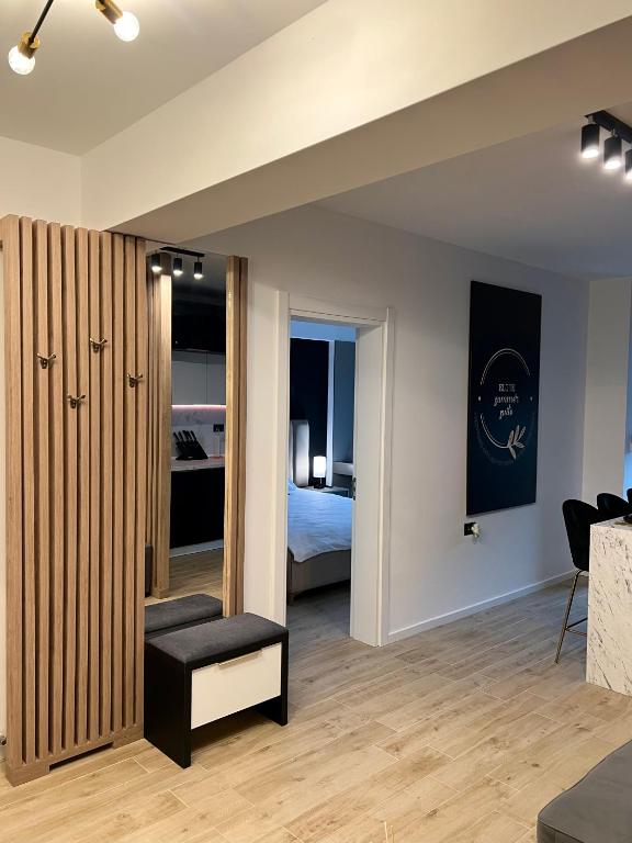 a living room with a bedroom and a bed at Elite Summer Suite in Năvodari