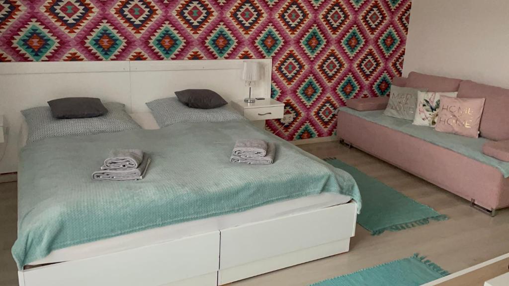 Posteľ alebo postele v izbe v ubytovaní Joy Apartman