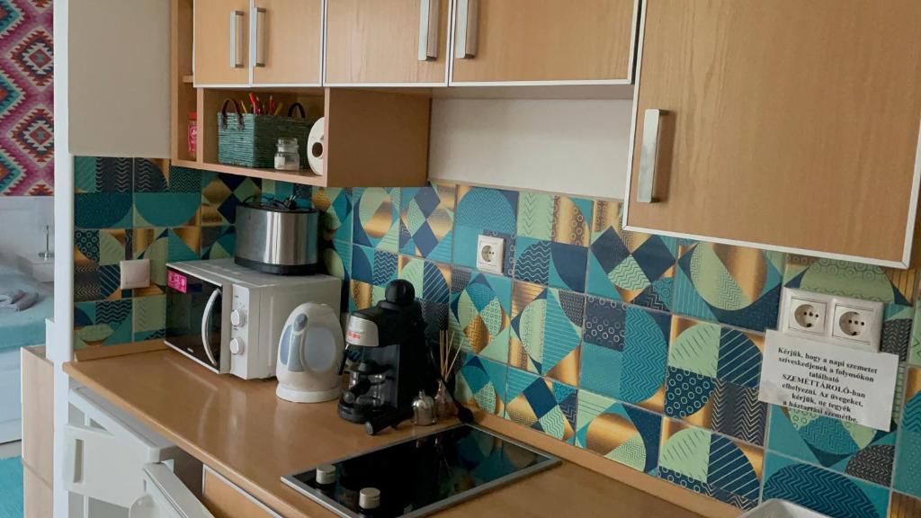 Kuchyňa alebo kuchynka v ubytovaní Joy Apartman