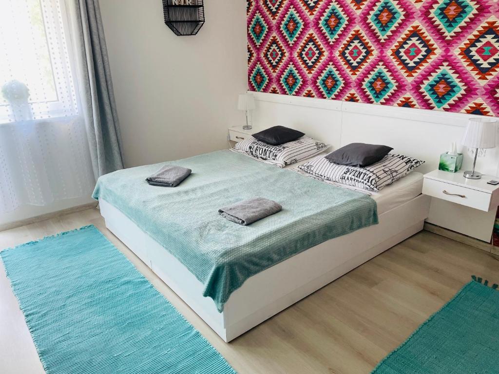 Posteľ alebo postele v izbe v ubytovaní Joy Apartman